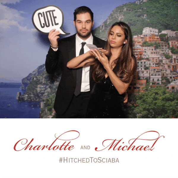 Italian Wedding Photo Booth Boomerang GiF of couple posing in front of a custom backdrop displaying the Amalfi Coast