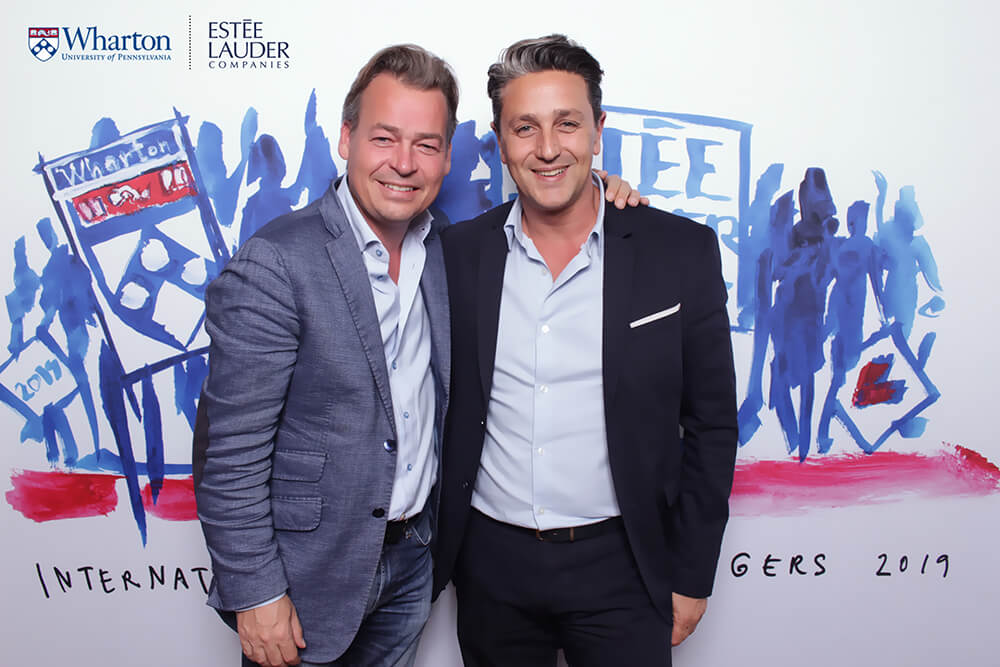 Estee Lauder Managers Function in San Francisco two men pose in a glam booth for Estee Lauder and Wharton University