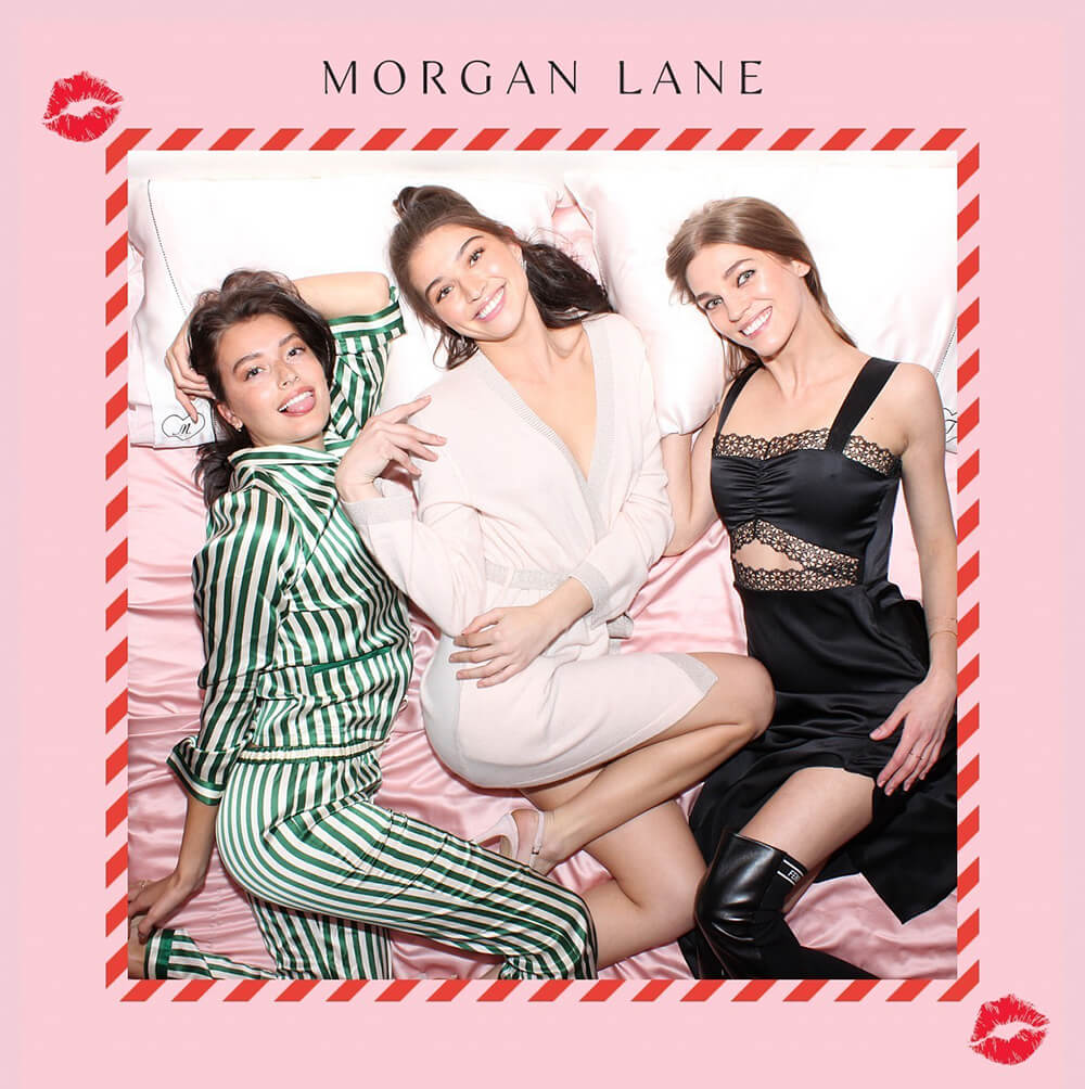 Morgan Lane Overhead Photo Booth three woman pose in pajamas in the Morgan Lane Overhead photo booth photo activation