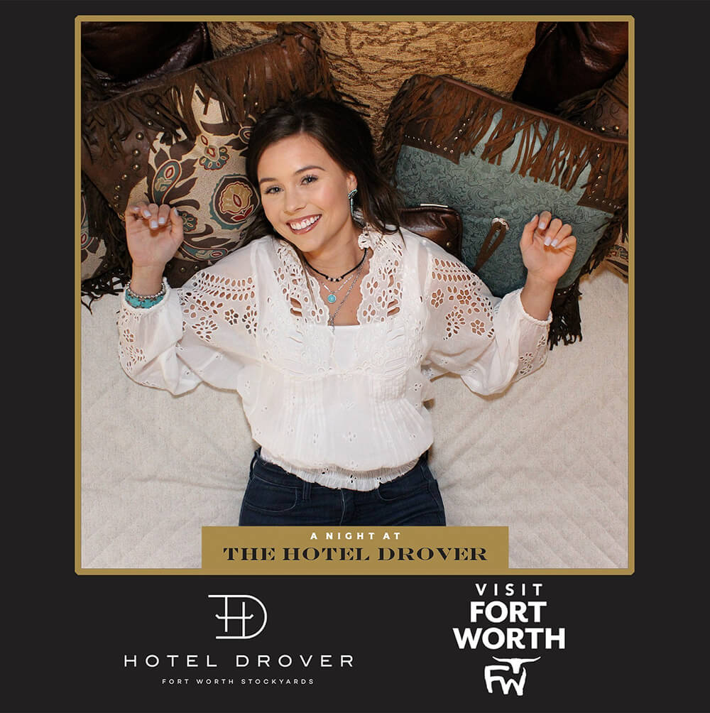 Hotel Drover Overhead Photo Booth A woman lies on a bed as her photo is taken with the Camera rigging above