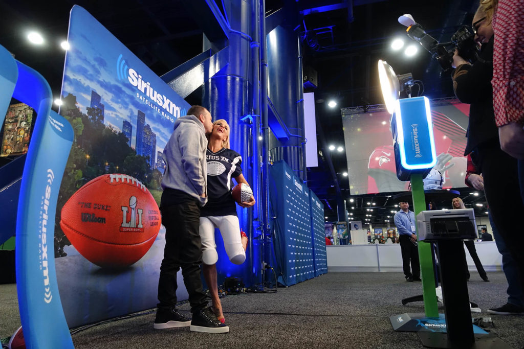 Donny Whalberg and Jenny McCarthy inside SiriusXM Super Bowl Photo Booth