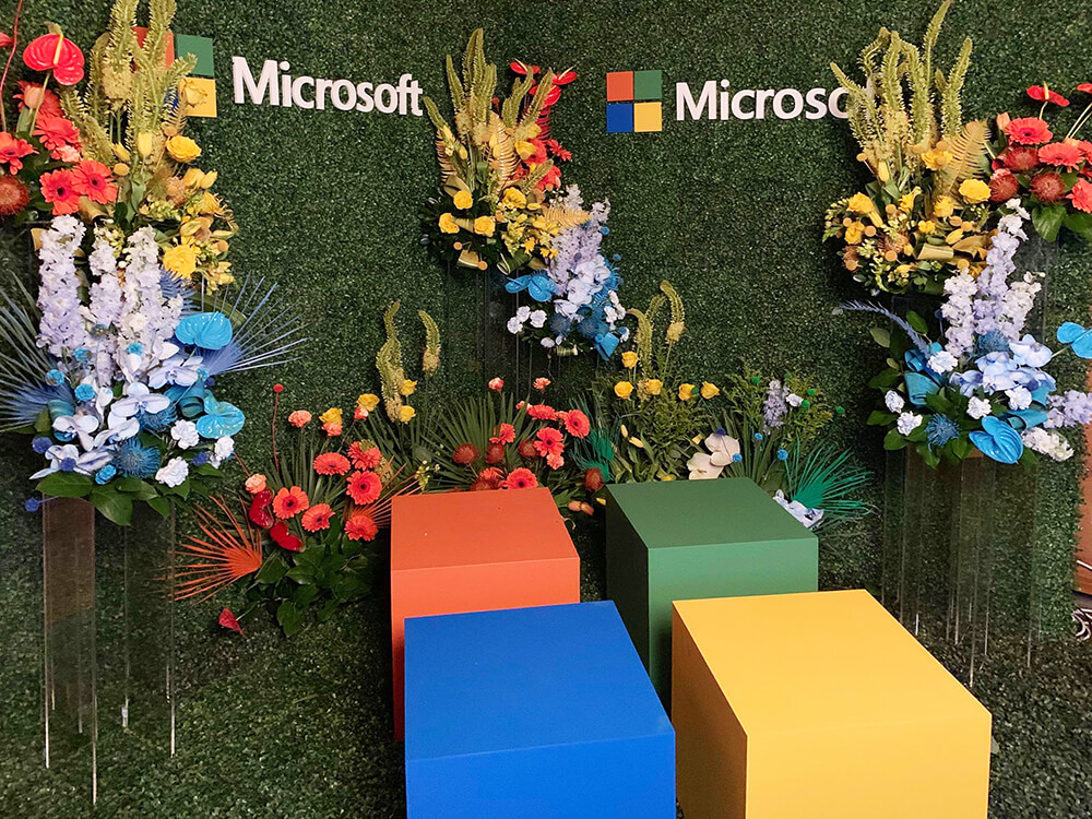 Microsoft GIF Booth Microsoft Photo Booth with Custom Set Design using Boxwood hedging and florals