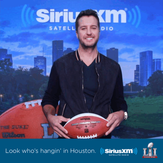 Luke Bryan SiriusXM at Super Bowl Luke Bryan tosses a football in the SiriusXM Boomerang Photo Booth at the Super Bowl in Houston
