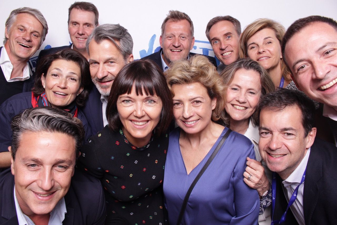 large group of staff in photo booth